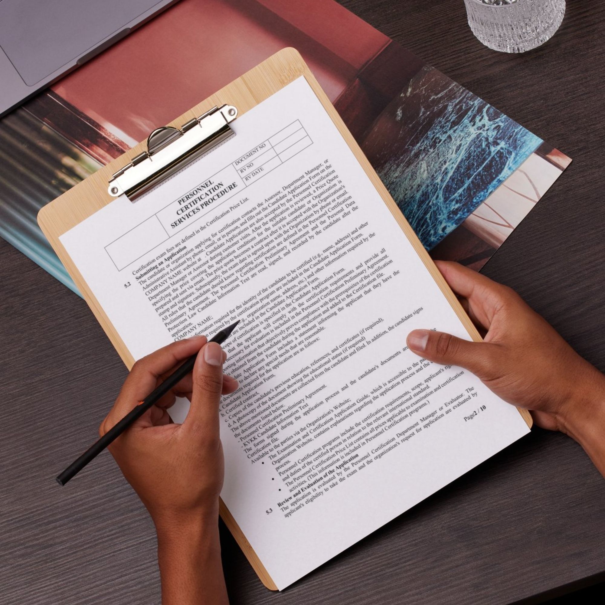 ISO certification document being reviewed and filled – quality template