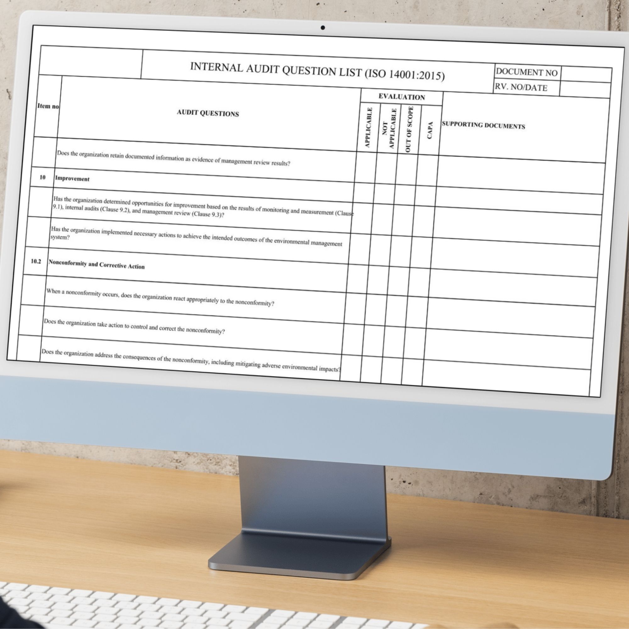 ISO 14001 audit checklist document displayed on desktop monitor clean workspace